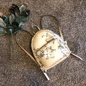 Guess Backpack Gold Floral Mini 10x8.5x4 inches.